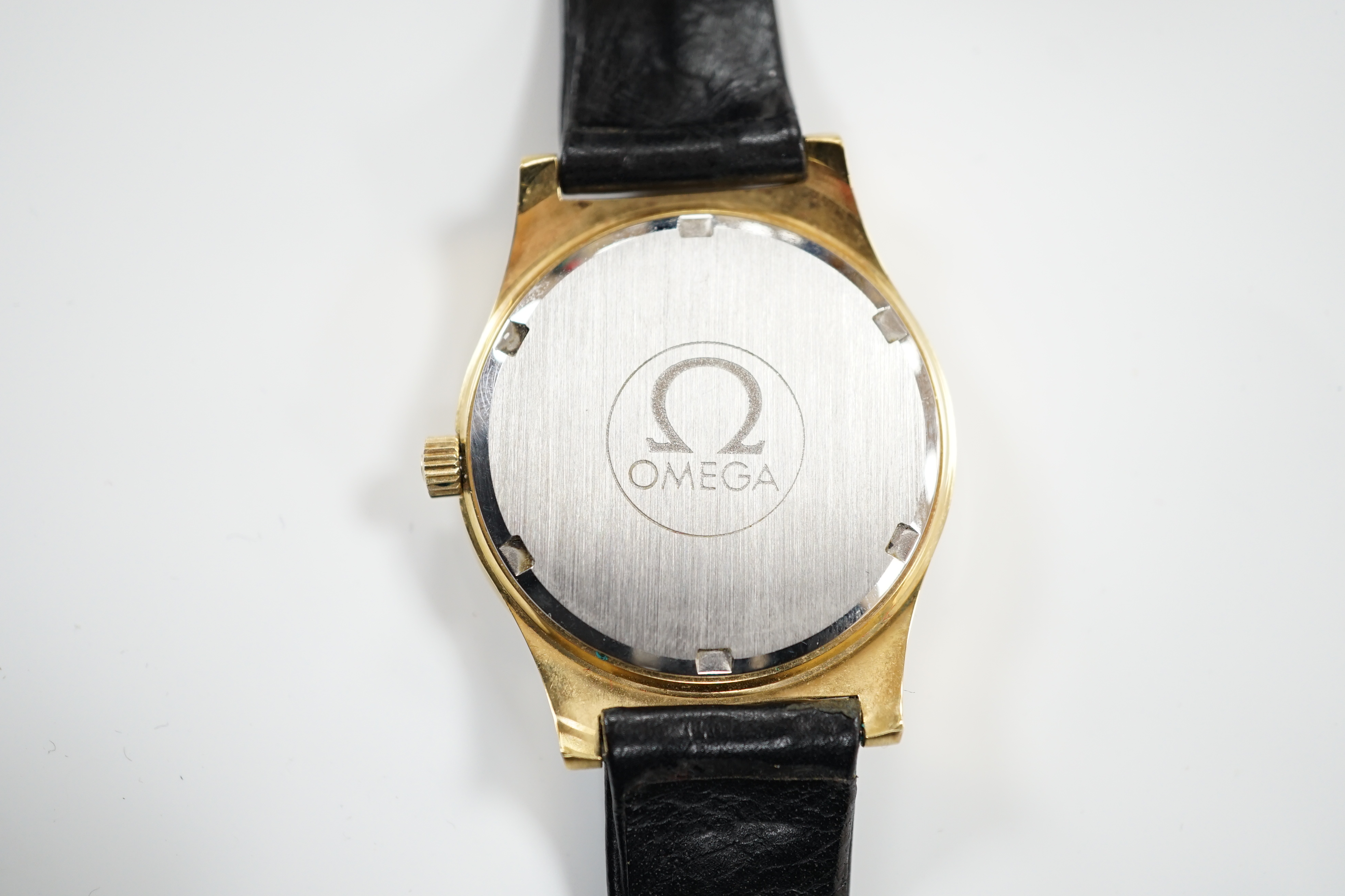 A gentleman's steel and gold plated Omega manual wind wrist watch, with date aperture, on an Omega leather strap with Omega buckle, case diameter 37mm, with box, no papers.